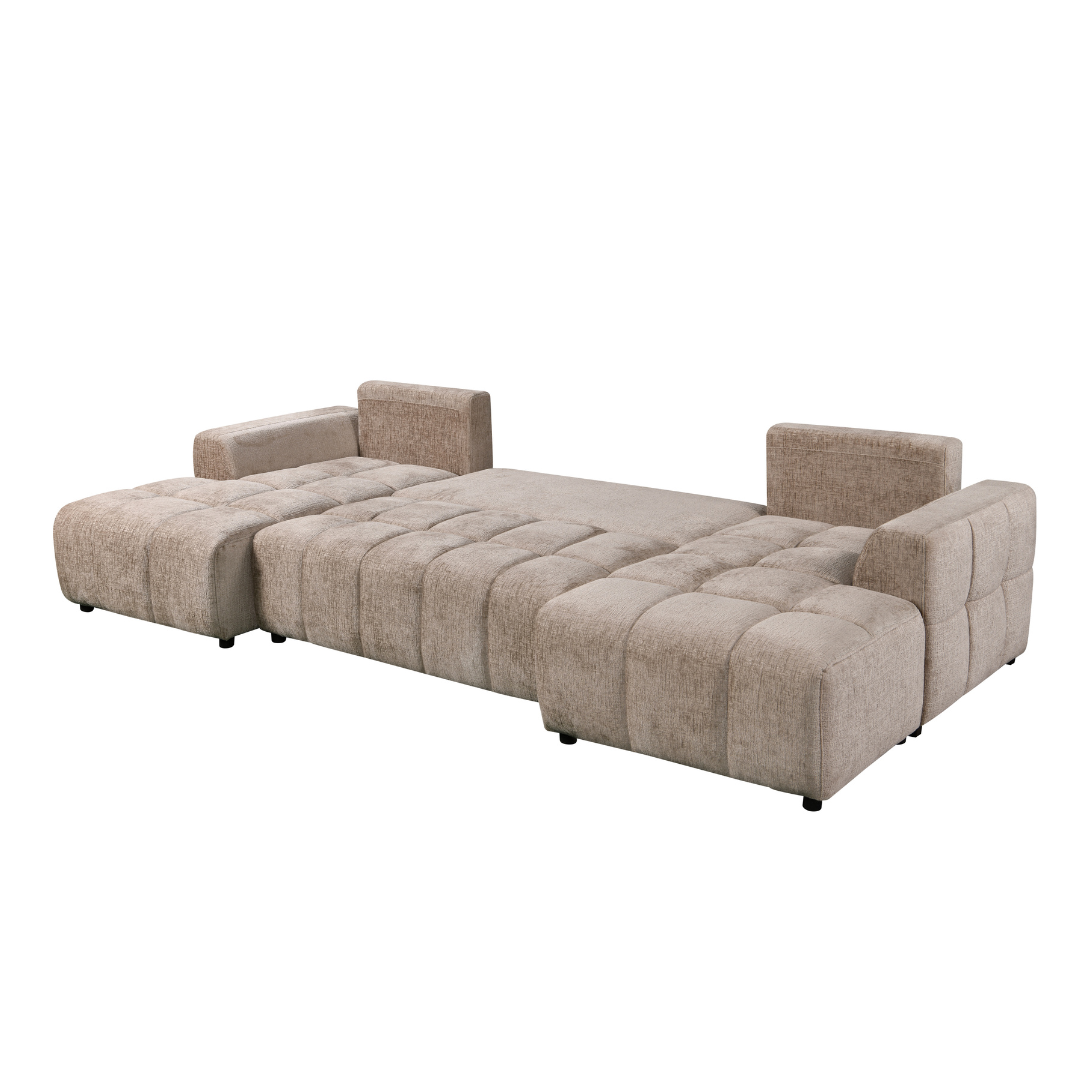 A modern tufted sectional sofa in a textured beige fabric, shown in its folded-out bed configuration on a plain white background.